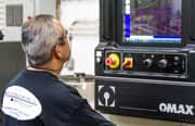 Image of worker using OMAX software