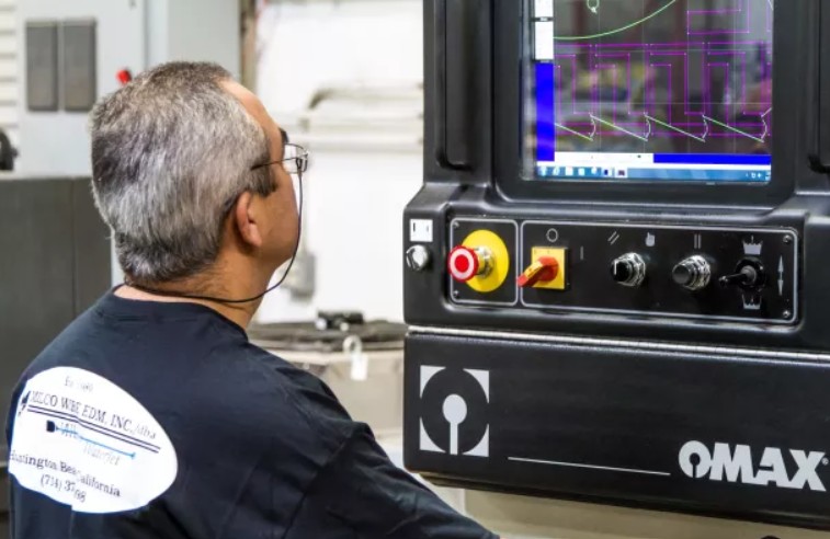 Image of worker using OMAX software