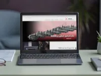 Image of computer showing new OMAX Arabic website